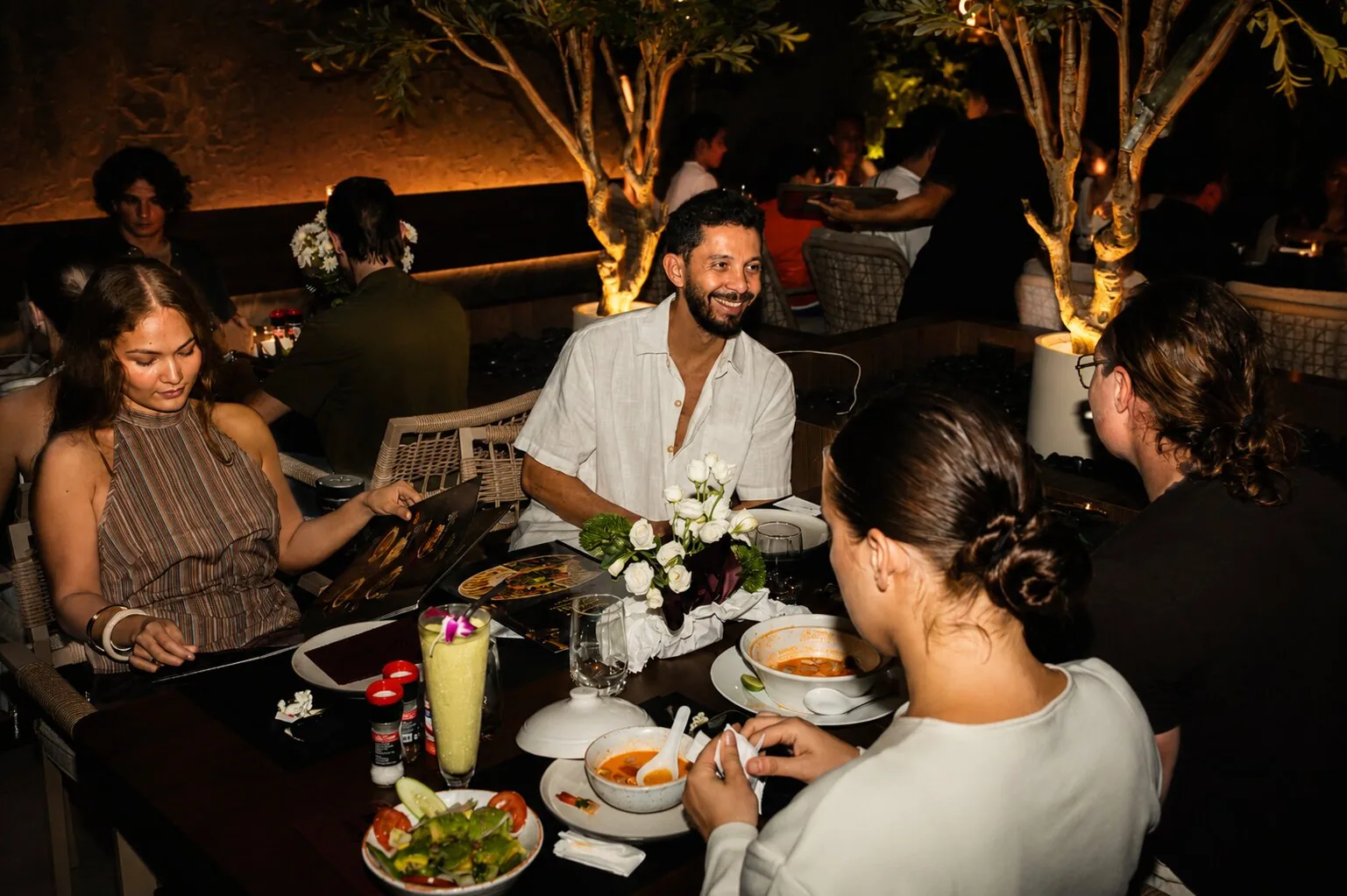 Friends enjoying dinner together at Marush in the evening.