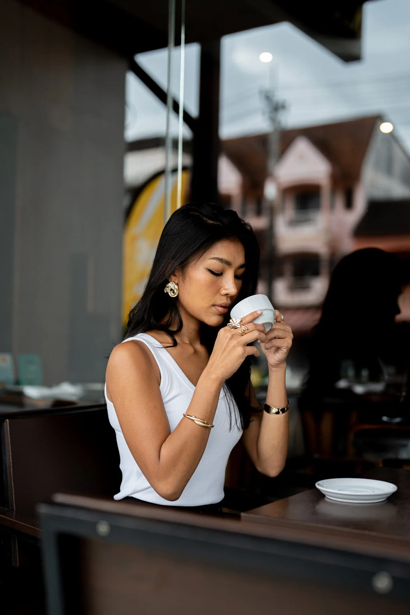 Guest enjoying coffee by the window at Marush.